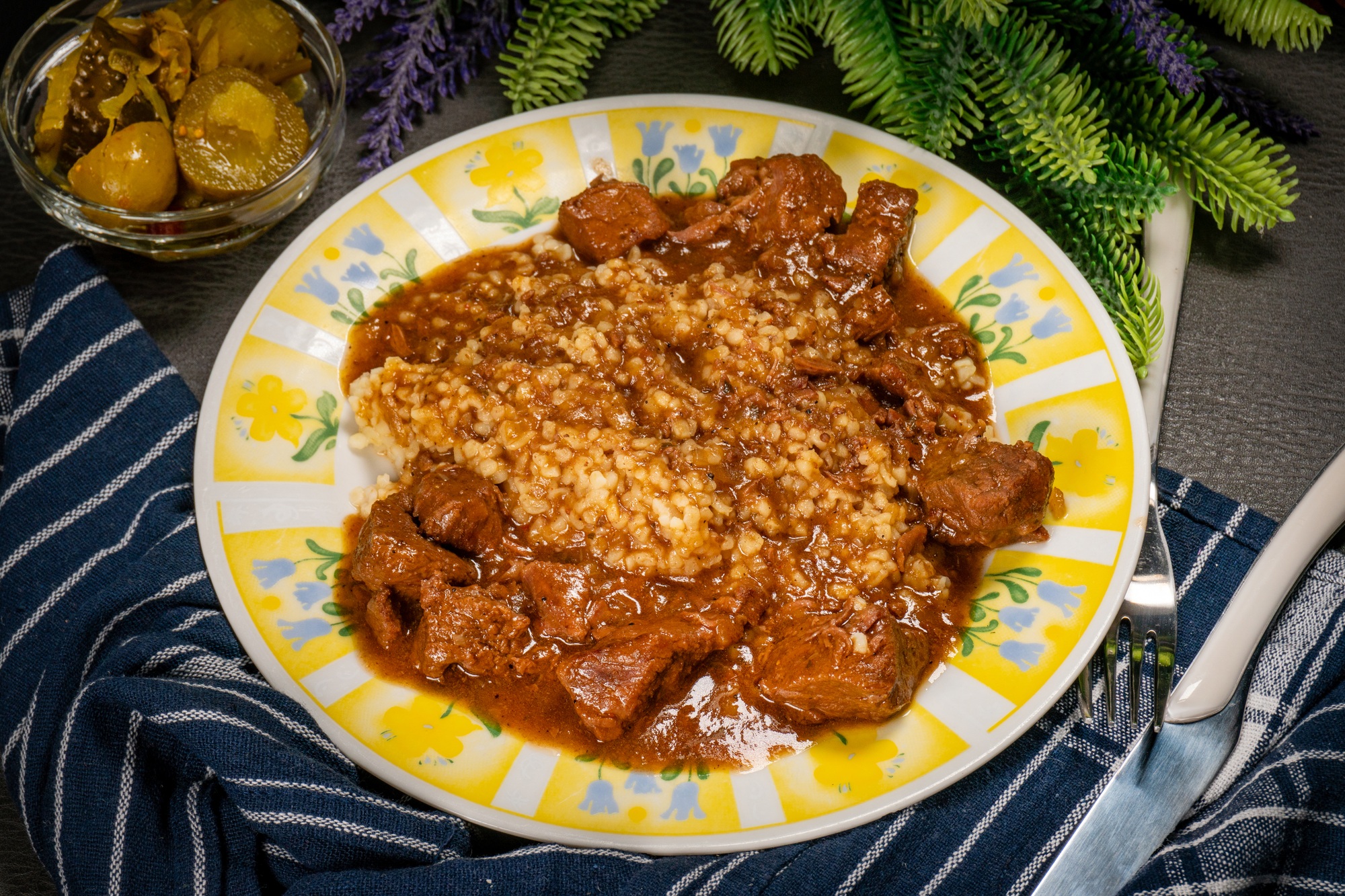 Beef goulash served with bulgur groats.